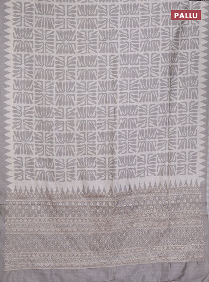 Art tussar saree cream and grey with allover ikat prints and embroidery pallu