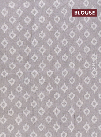 Art tussar saree cream and grey with allover ikat prints and embroidery pallu