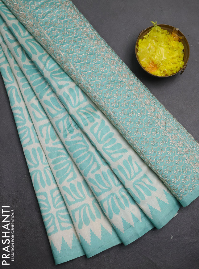 Art tussar saree cream and teal green with allover ikat prints and embroidery pallu