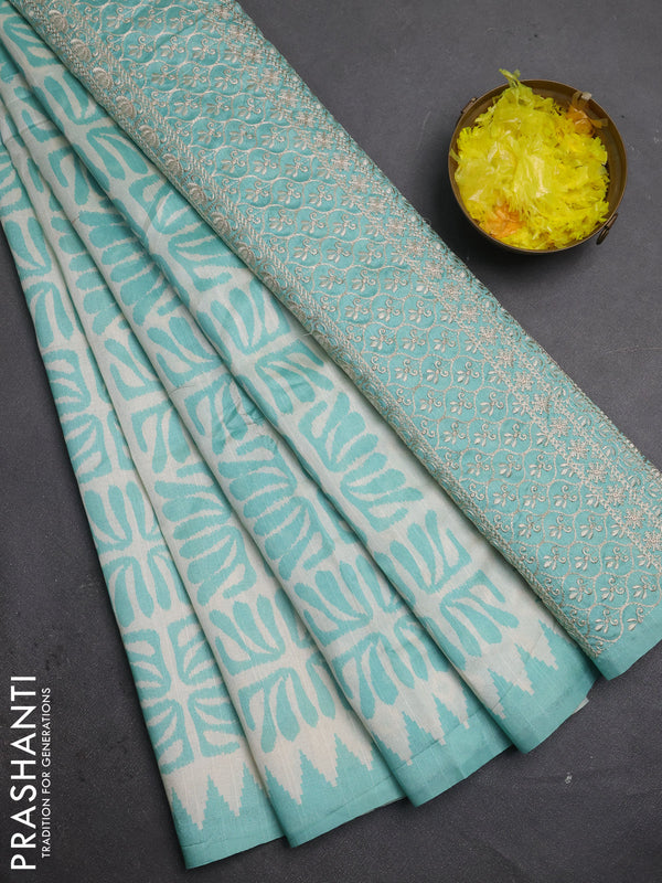 Art tussar saree cream and teal green with allover ikat prints and embroidery pallu