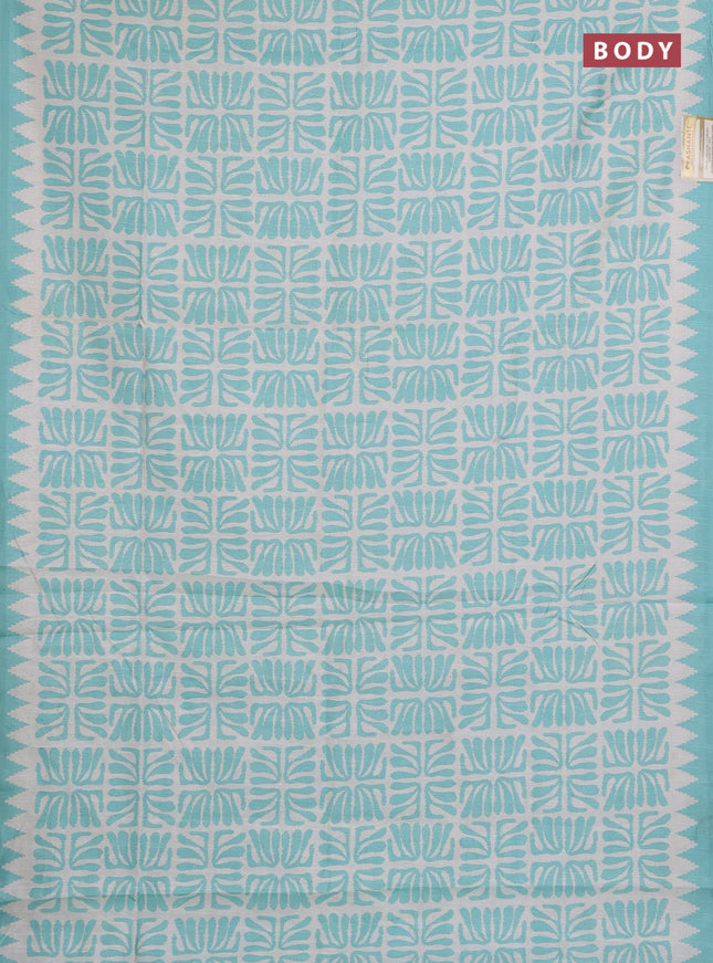 Art tussar saree cream and teal green with allover ikat prints and embroidery pallu