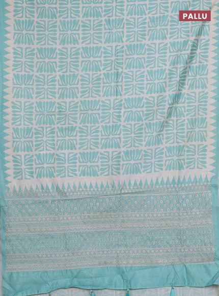 Art tussar saree cream and teal green with allover ikat prints and embroidery pallu