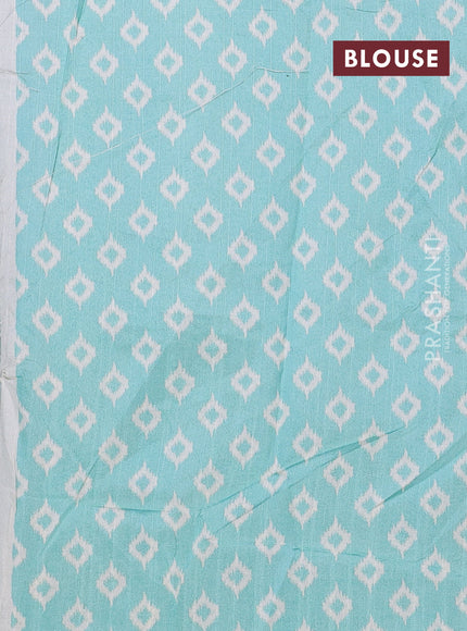 Art tussar saree cream and teal green with allover ikat prints and embroidery pallu