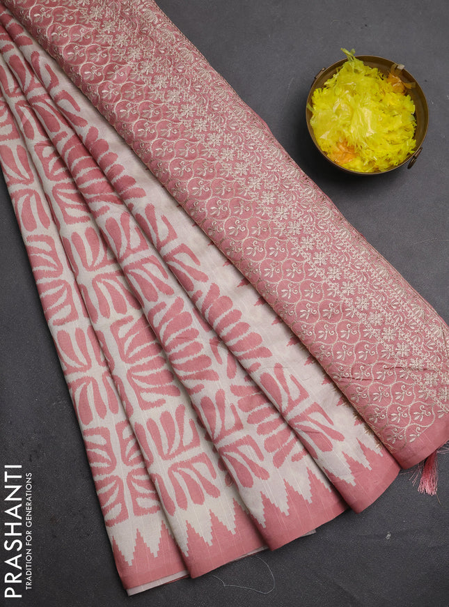 Art tussar saree cream and peach shade with allover ikat prints and embroidery pallu