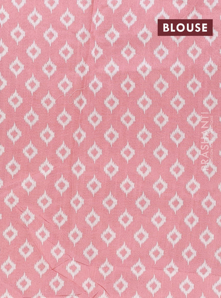 Art tussar saree cream and peach shade with allover ikat prints and embroidery pallu