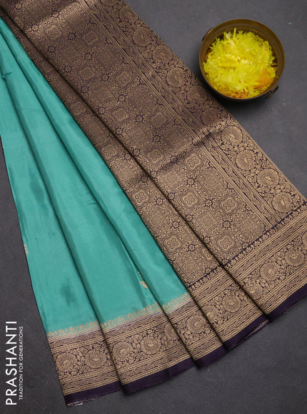 Semi mysore silk saree teal green and jamun shade with allover floral zari woven buttas and zari woven border