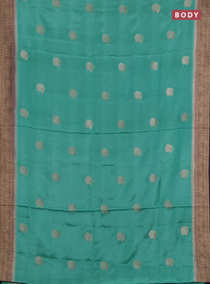 Semi mysore silk saree teal green and jamun shade with allover floral zari woven buttas and zari woven border