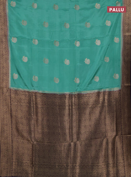 Semi mysore silk saree teal green and jamun shade with allover floral zari woven buttas and zari woven border