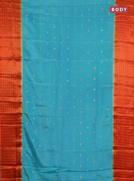 Semi mysore silk saree teal green and orange allover zari woven buttas and zari checks muniya butta border