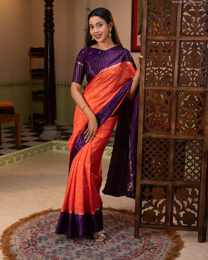 Semi mysore silk saree orange and purple allover zari woven buttas and zari checks muniya butta border