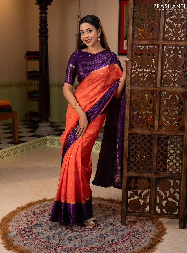 Semi mysore silk saree orange and purple allover zari woven buttas and zari checks muniya butta border