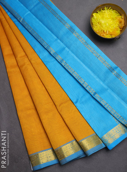 Silk cotton saree mustard yellow and cs blue with plain body and zari woven border