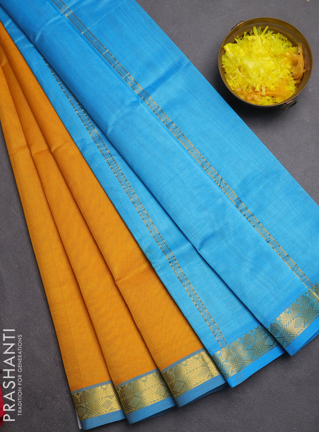 Silk cotton saree mustard yellow and cs blue with plain body and zari woven border
