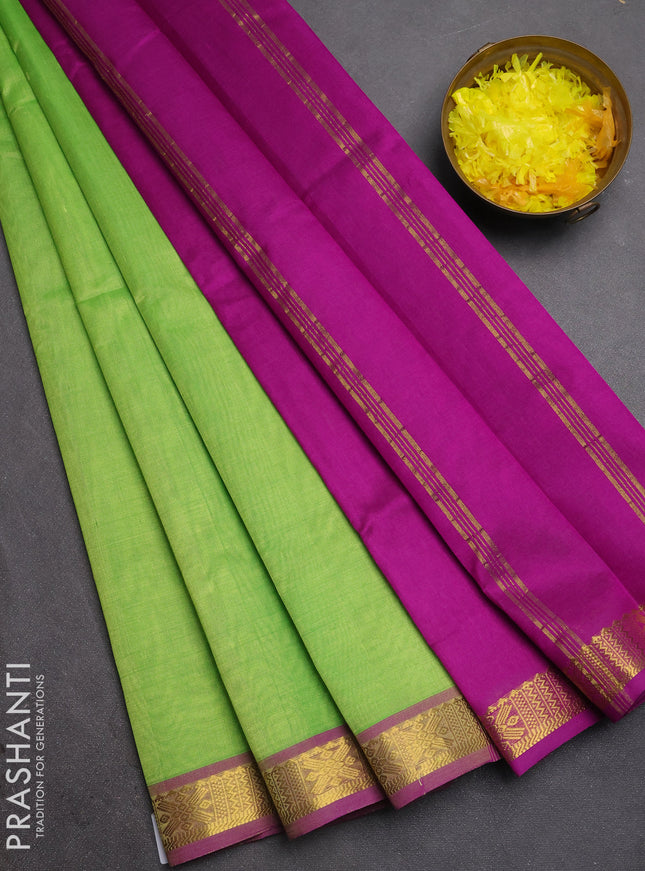 Silk cotton saree light green and purple with plain body and zari woven border