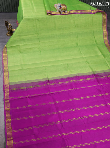 Silk cotton saree light green and purple with plain body and zari woven border