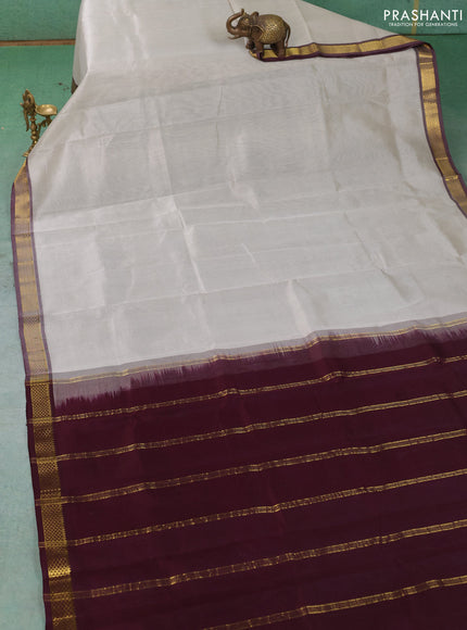 Silk cotton saree pastel grey and deep wine shade with plain body and zari woven border
