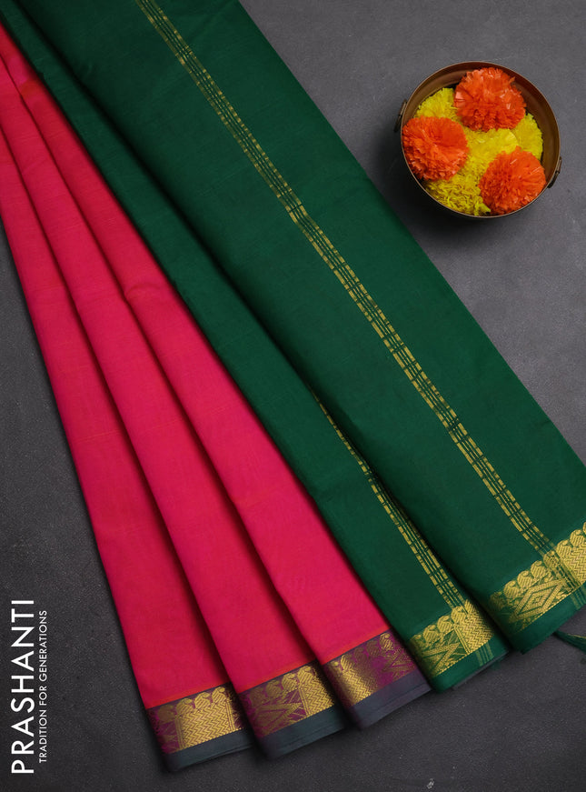 Silk cotton saree candy pink and green with plain body and zari woven border