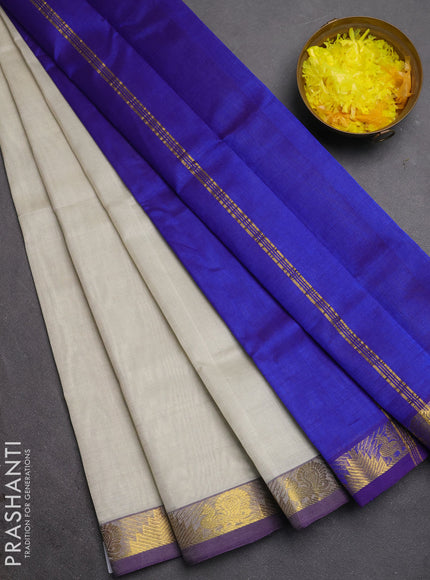 Silk cotton saree pastel grey and royal blue with plain body and annam & temple zari woven border