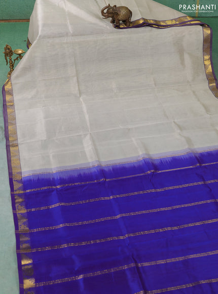 Silk cotton saree pastel grey and royal blue with plain body and annam & temple zari woven border