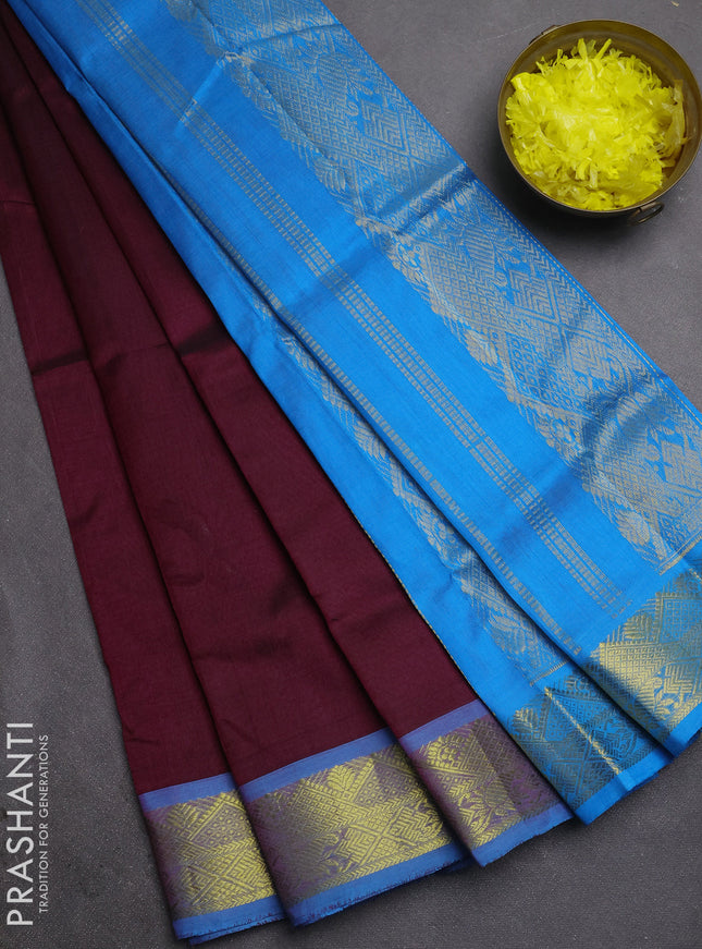 Silk cotton saree deep wine shade and cs blue with plain body and zari woven border