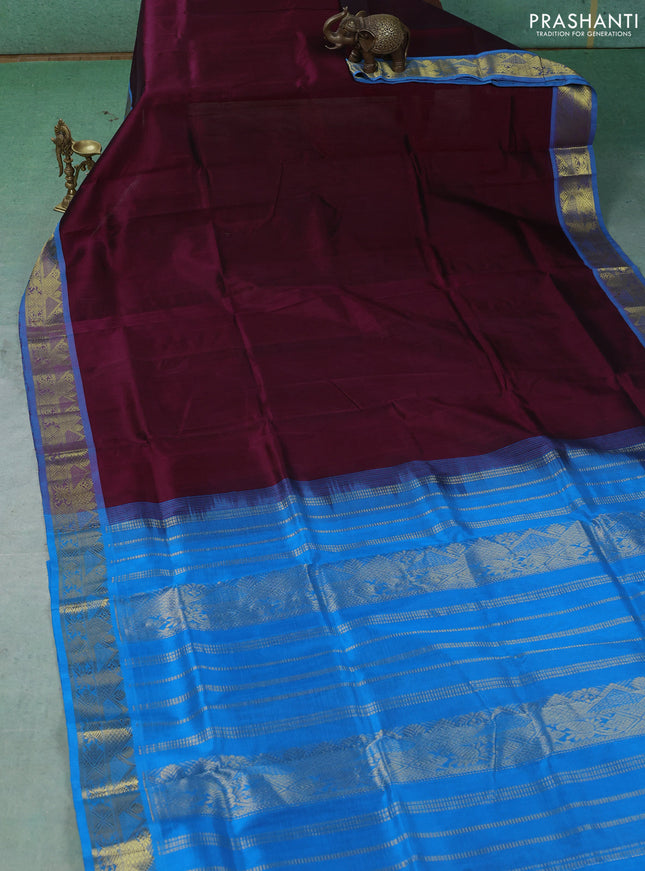Silk cotton saree deep wine shade and cs blue with plain body and zari woven border