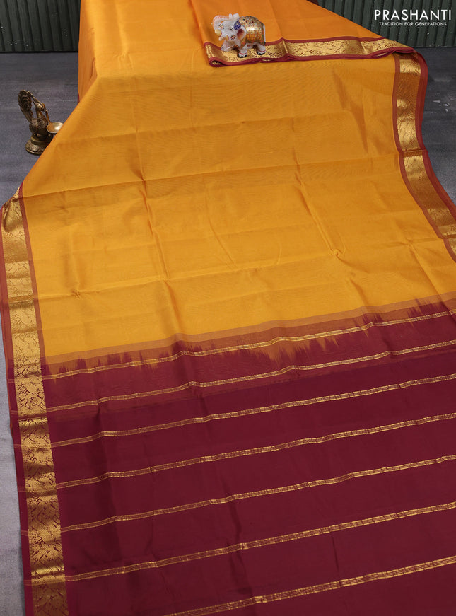 Silk cotton saree mustard yellow and deep maroon with plain body and zari woven border