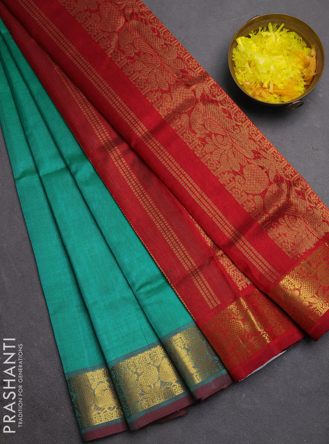 Silk cotton saree teal green and maroon with plain body and zari woven border