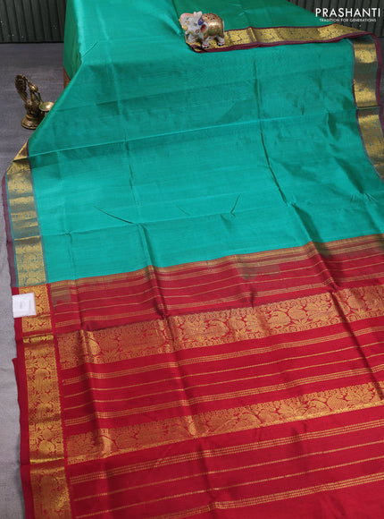 Silk cotton saree teal green and maroon with plain body and zari woven border
