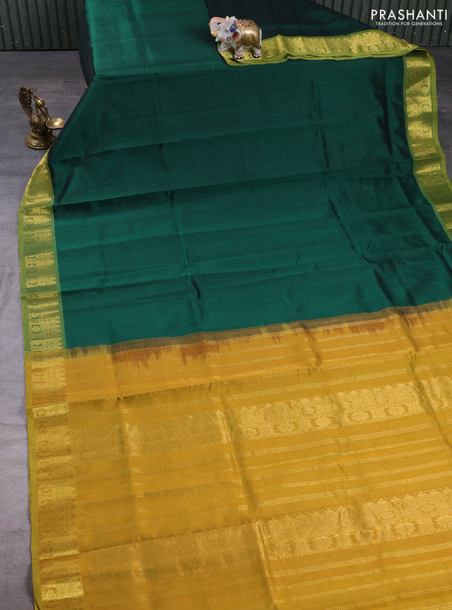 Silk cotton saree green and mehendi green with plain body and zari woven border