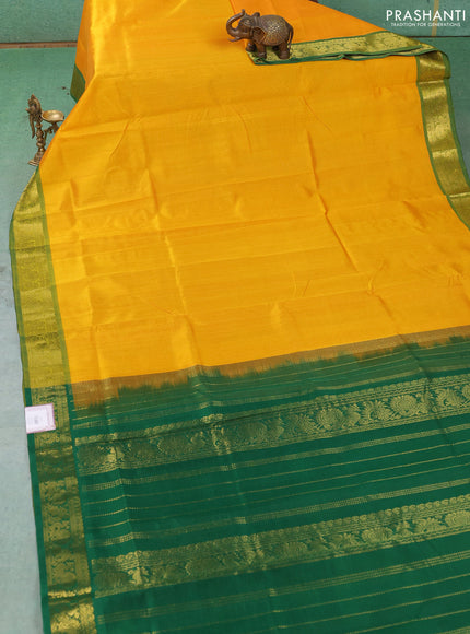 Silk cotton saree mango yellow and green with plain body and zari woven border