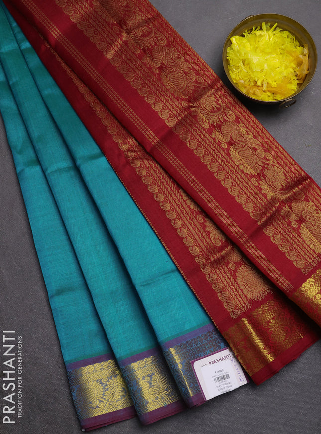 Silk cotton saree teal blue and maroon with plain body and zari woven border