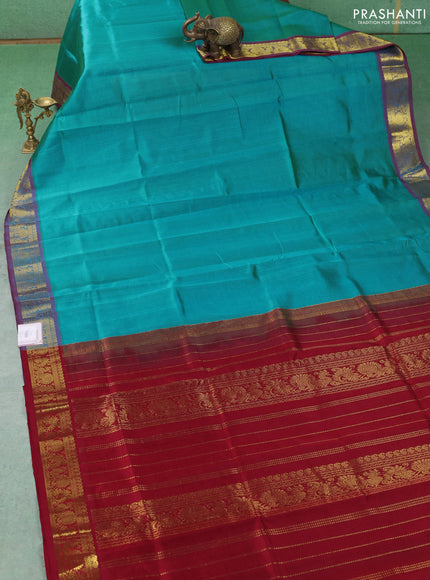 Silk cotton saree teal blue and maroon with plain body and zari woven border
