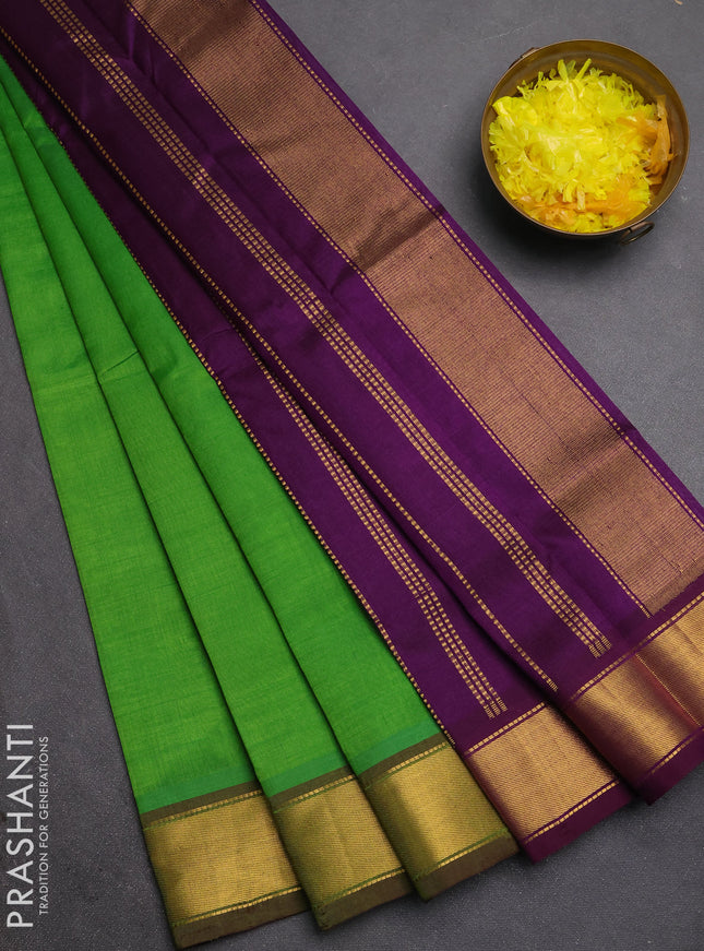 Silk cotton saree green and violet with plain body and zari woven border