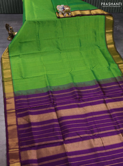 Silk cotton saree green and violet with plain body and zari woven border