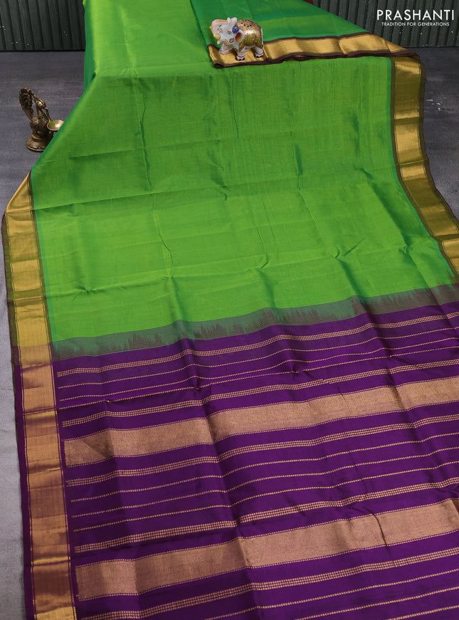 Silk cotton saree green and violet with plain body and zari woven border