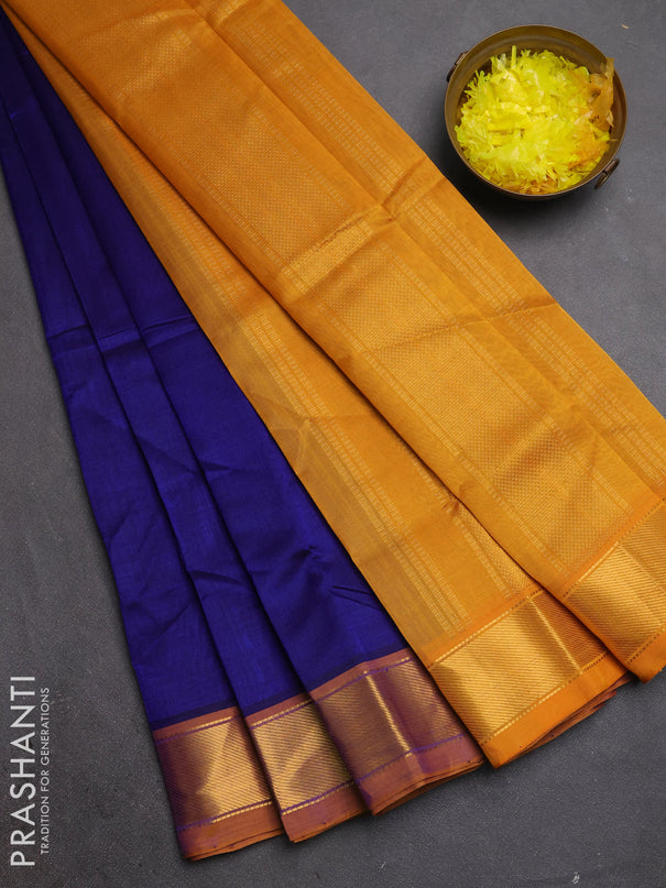 Silk cotton saree peacock blue and dark mustard with plain body and zari woven border
