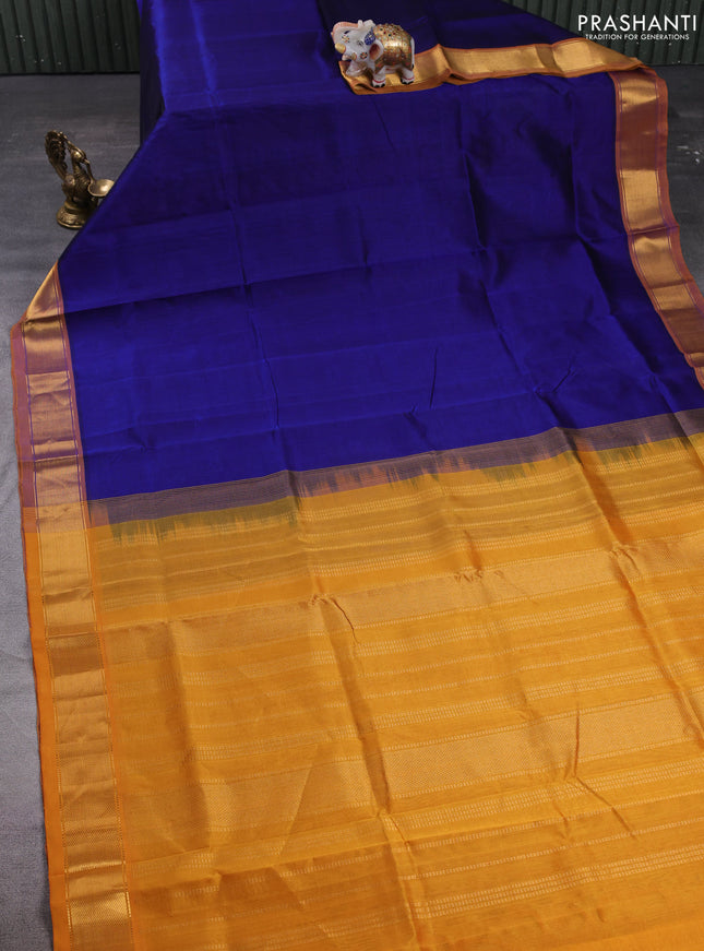 Silk cotton saree peacock blue and dark mustard with plain body and zari woven border