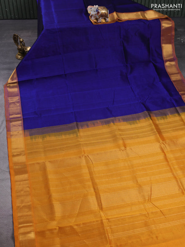 Silk cotton saree peacock blue and dark mustard with plain body and zari woven border