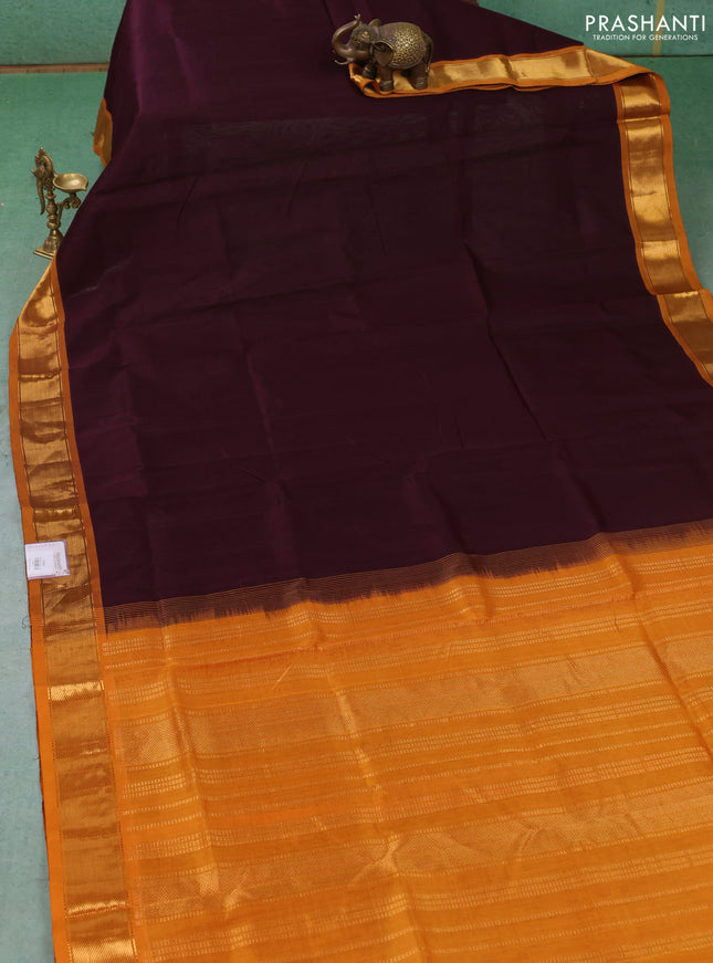 Silk cotton saree deep wine shade and dark mustard with plain body and zari woven border