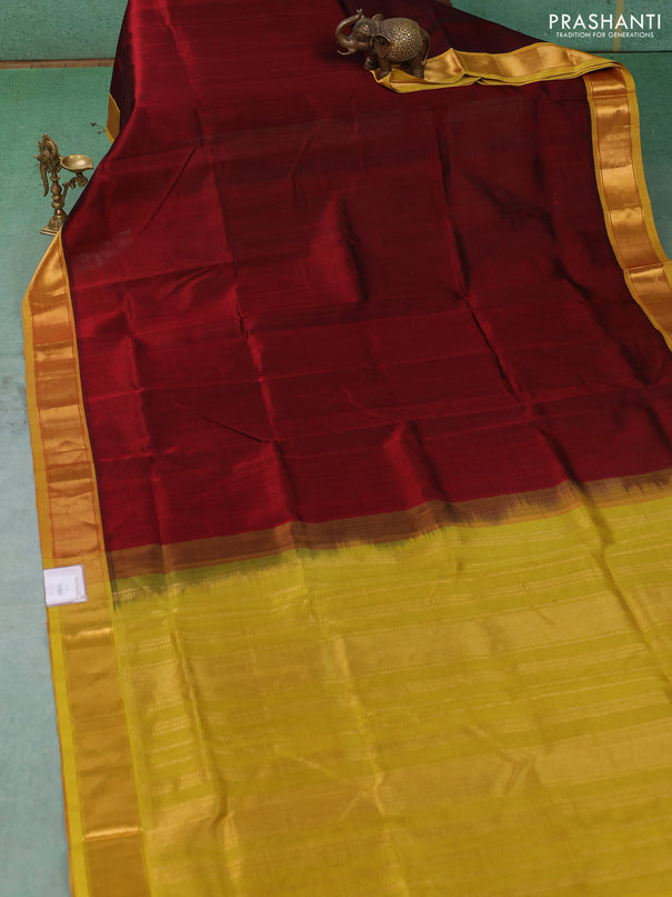 Silk cotton saree deep maroon and mustard green with allover stripe pattern and zari woven border