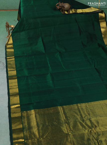 Silk cotton saree bottle green with plain body and zari woven border