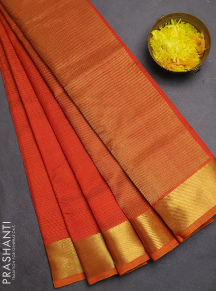 Silk cotton saree sunset orange with allover stripe pattern and zari woven border