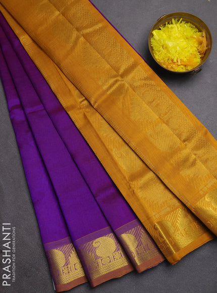 Silk cotton saree purple and mustard yellow with plain body and paisley & temple zari woven border