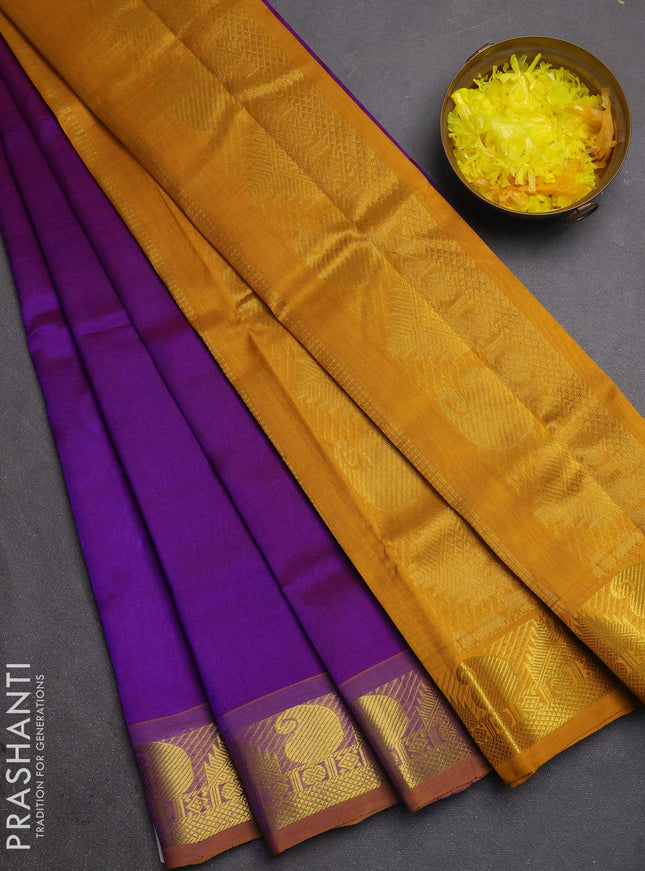 Silk cotton saree purple and mustard yellow with plain body and paisley & temple zari woven border