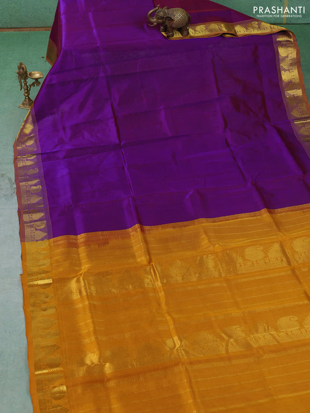 Silk cotton saree purple and mustard yellow with plain body and paisley & temple zari woven border