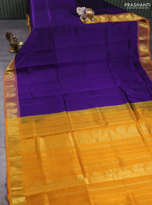 Silk cotton saree violet and mustard yellow with plain body and paisley & temple zari woven border