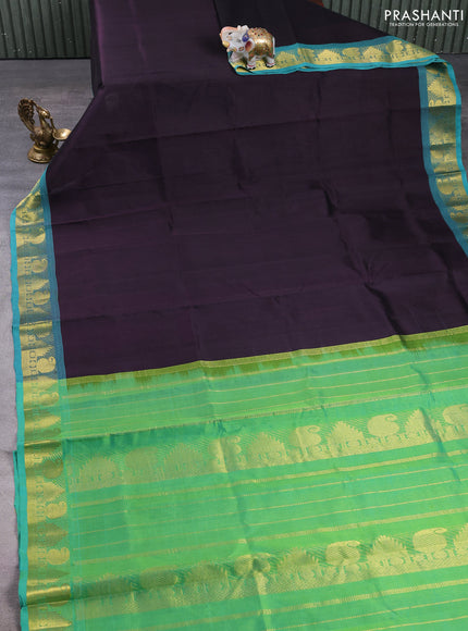 Silk cotton saree jamun shade and teal green with plain body and paisley & temple zari woven border