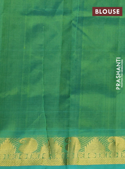Silk cotton saree jamun shade and teal green with plain body and paisley & temple zari woven border