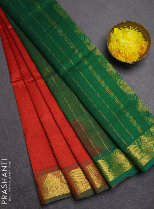 Silk cotton saree rust shade and green with plain body and paisley & temple zari woven border