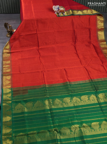 Silk cotton saree rust shade and green with plain body and paisley & temple zari woven border